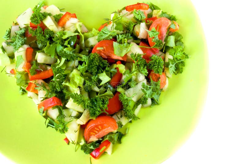 Healthy food heart shaped fresh vegetable salad