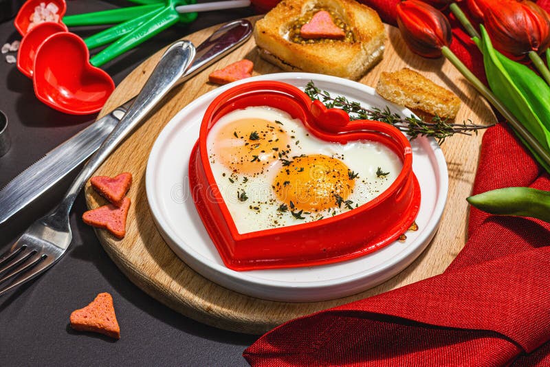 Heart-shaped Fried Egg Served with Toasted Bread. Romantic Art Food ...