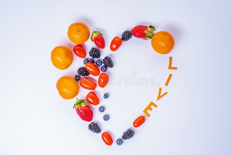 Heart Shaped Fruit Arrangement with the word Live and one empty half for text . stock image Heart Shaped Fruit Arrangement with the word Live and one empty half for text . stock image