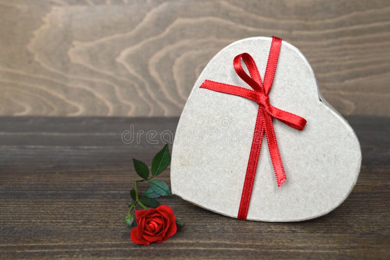 Heart shaped gift box and rose