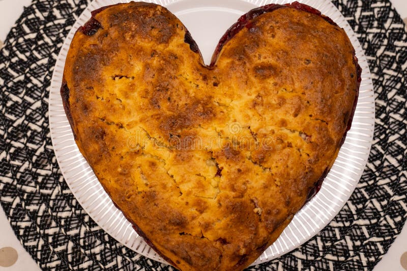 Heart Shaped Homemade Cherry Pie on White Plate on Kitchen Table. Stock Photo Image of