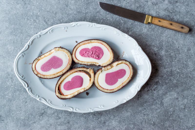 Heart Shaped Ice Cream Roll Cake with Vanilla and Chocolate. stock photography