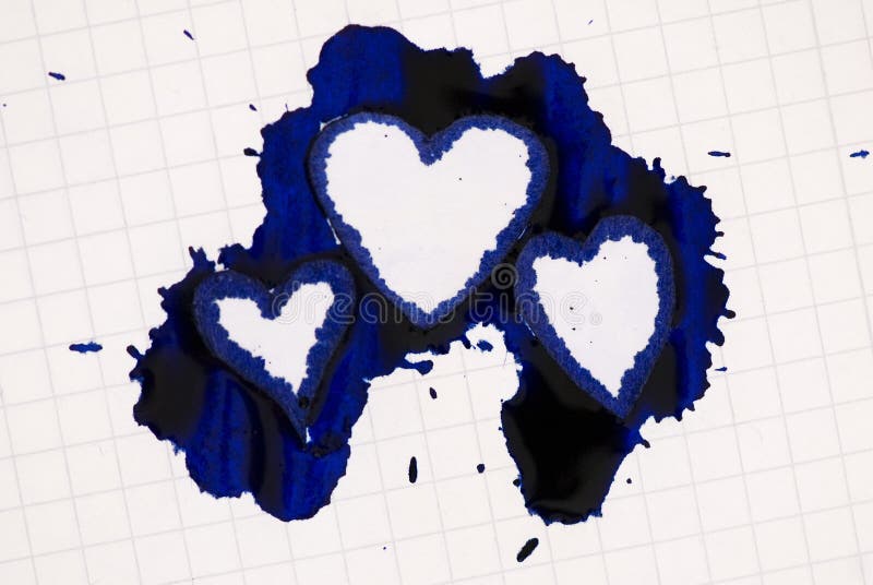 Heart shaped ink blot on paper