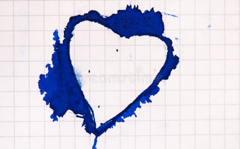 Heart shaped ink blot on paper