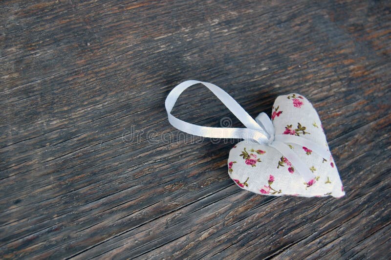 Heart shaped lavender bag on wooden table