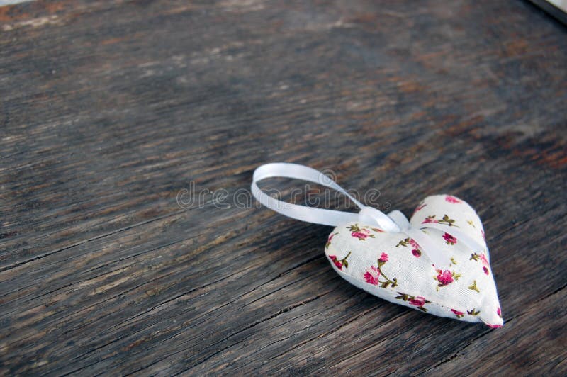 Heart shaped lavender bag on wooden table
