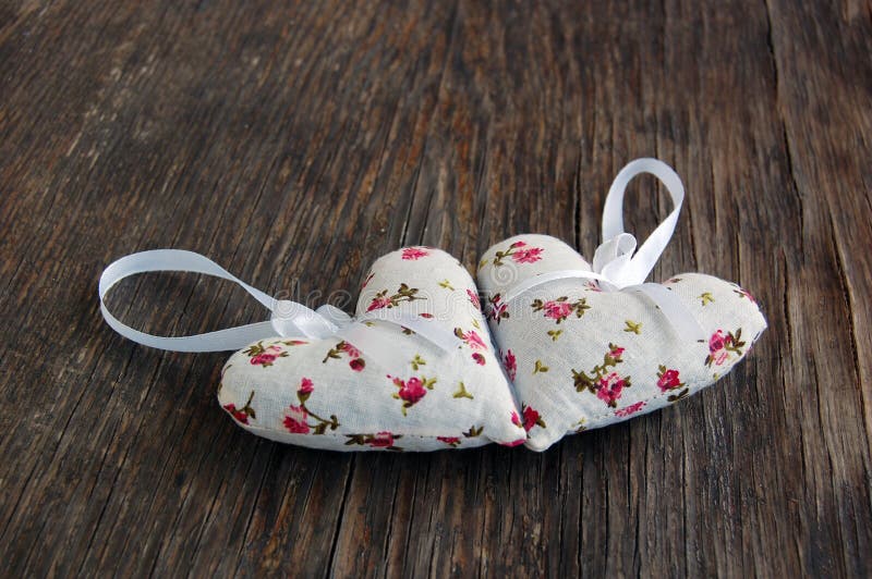 Heart shaped lavender bags on wooden table