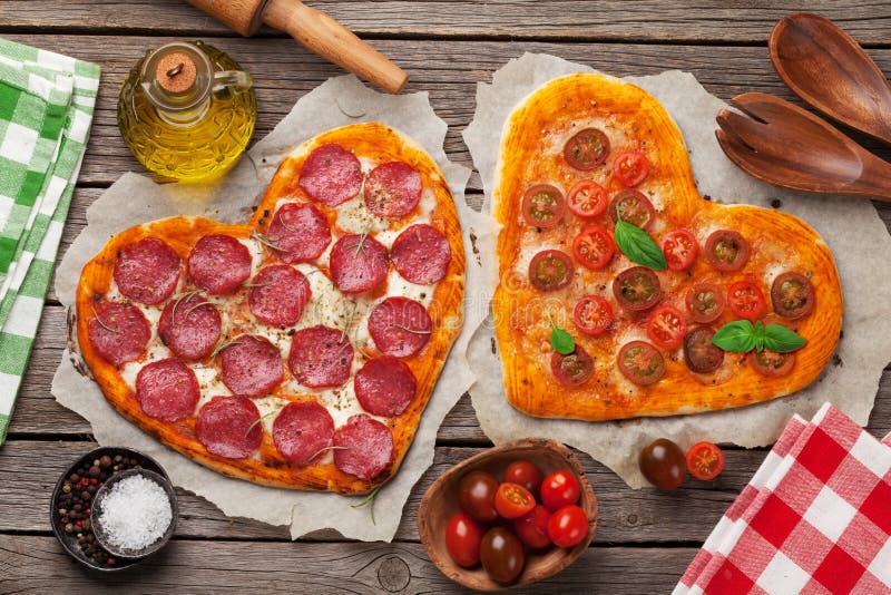 Heart Shaped Pizza with Tomatoes and Mozzarella and Pepperoni Stock ...
