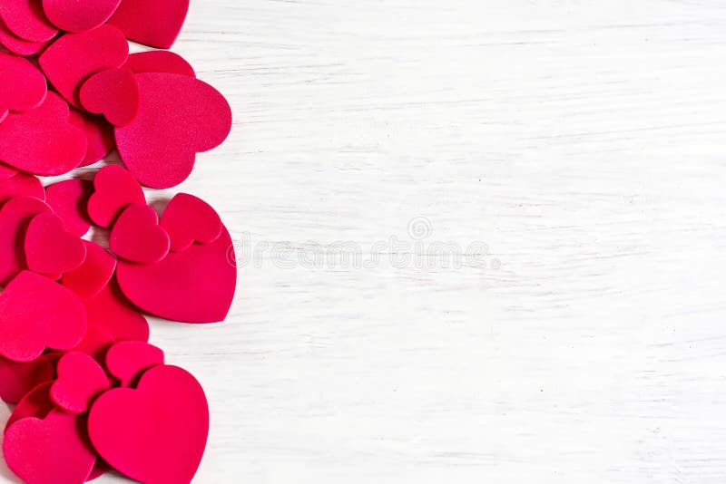 Various size valentine's day hearts on white wooden background. Copy space background. Various size valentine's day hearts on white wooden background. Copy space background.