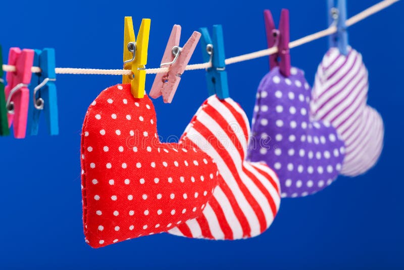 Hearts hanging on a clothesline with clothespins