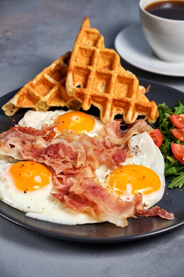 Hearty Breakfast of Scrambled Eggs with Bacon, Waffles, a Salad of ...