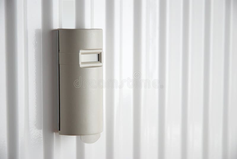 Heat cost allocator on heater stock photos