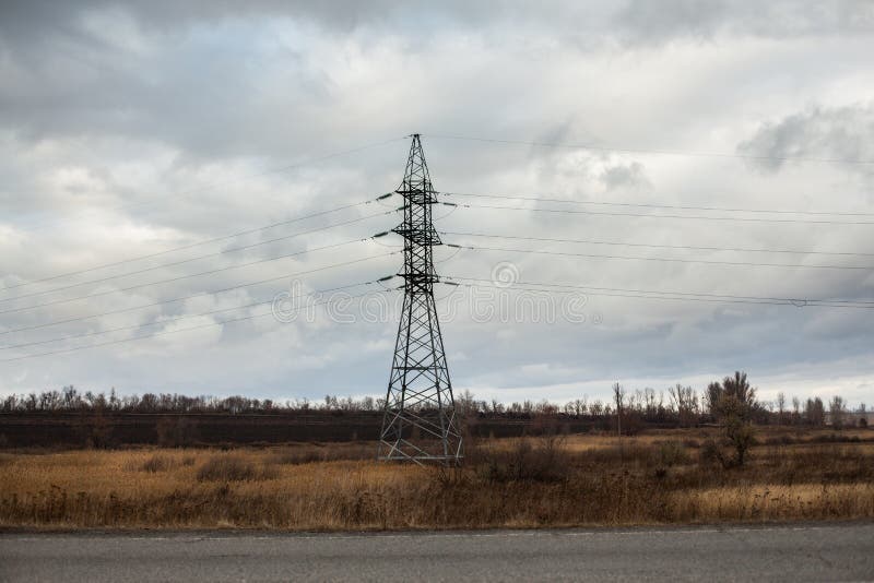 Heat haze rises as powerlines blur into the distance