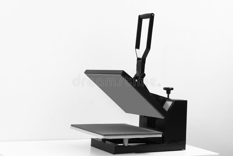 Heat Press Machine On Table Against Light Stock Photo Image Of