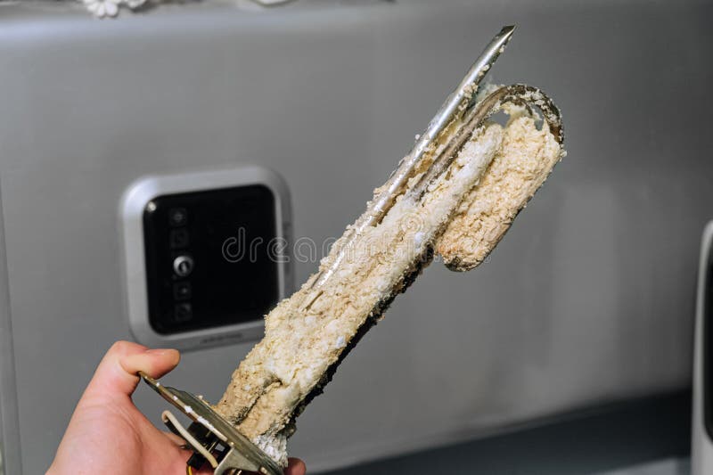 Heating Element of an Electric Water Heater with a Rusty Anode and a