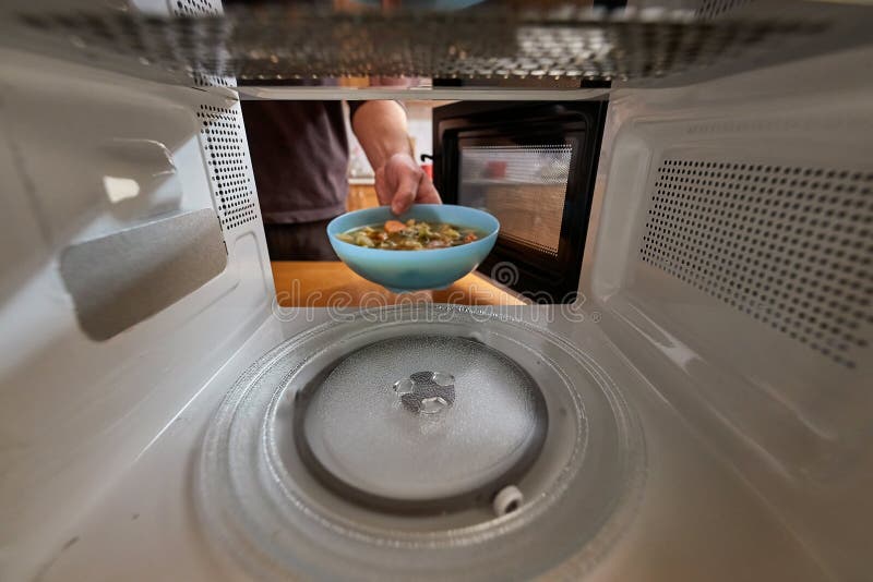 Heating Food in a Microwave Oven Stock Photo - Image of kitchen, door:  236057510