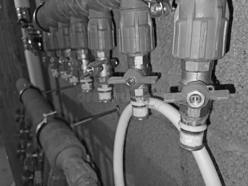 Heating pipes on the wall stock photo. Image of heating 236953198