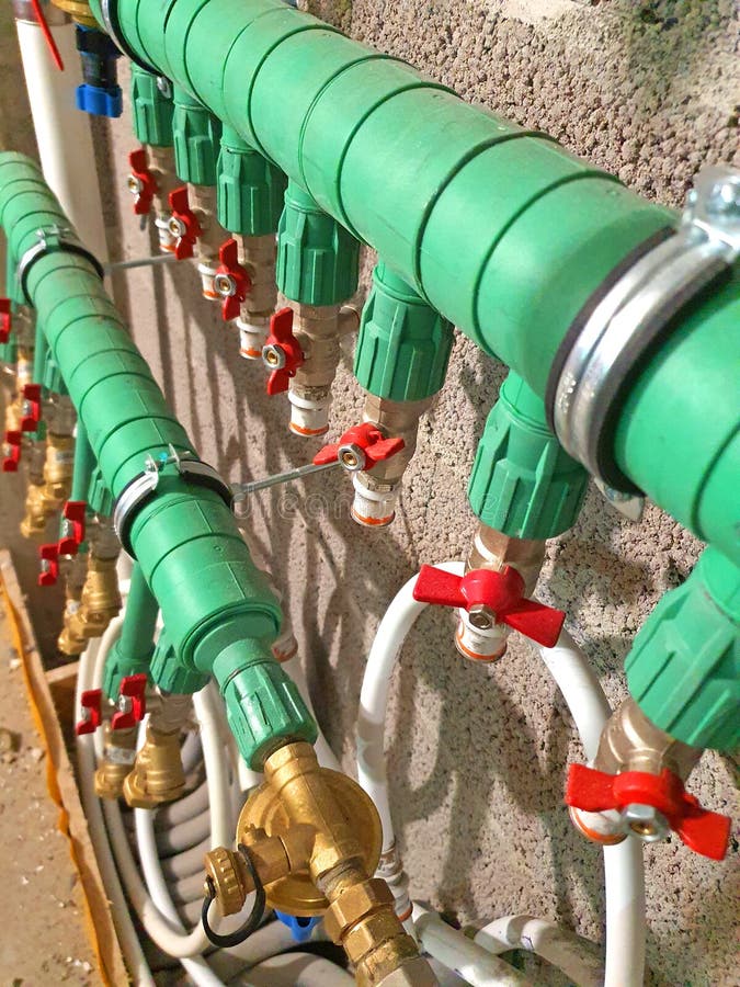 Heating pipes on the wall stock photo. Image of industry 236955478