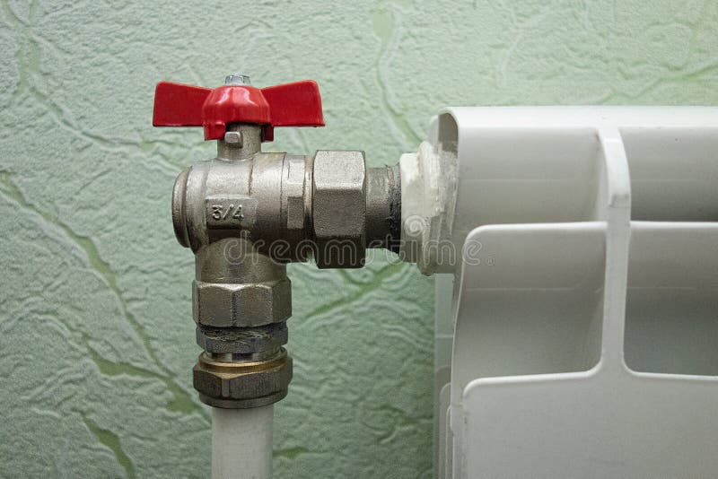 Heating radiator valve closeup view. Winter temperature control and heat consumption stock photo Heating radiator valve closeup view. Winter temperature control and heat consumption stock photo