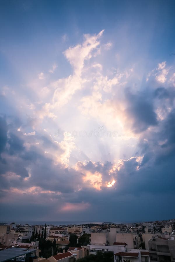 Heavenly Light Rays Piercing Through the Clouds over the Greek S royalty free stock photos