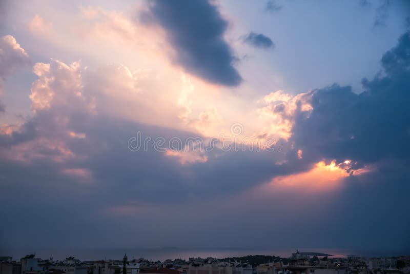 Heavenly Light Rays Piercing Through the Clouds over the Greek S royalty free stock images