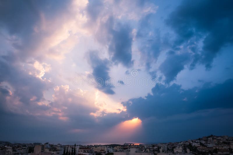 Heavenly Light Rays Piercing Through the Clouds over the Greek S royalty free stock photos