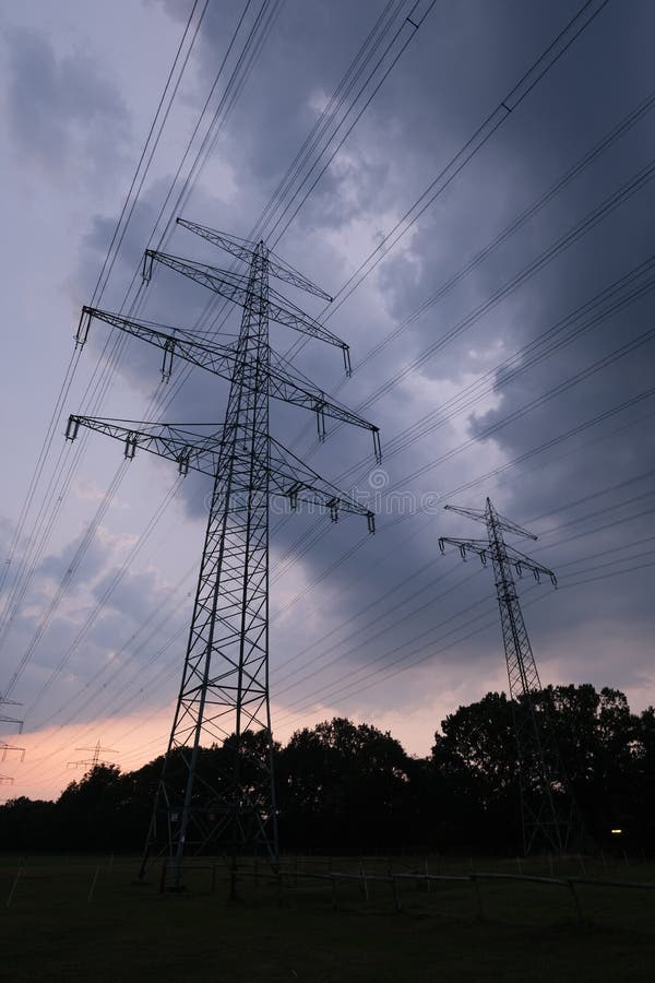 Heavy clouds behind a power line