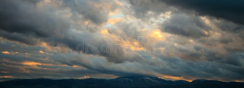Heavy clouds over mountains royalty free stock photos