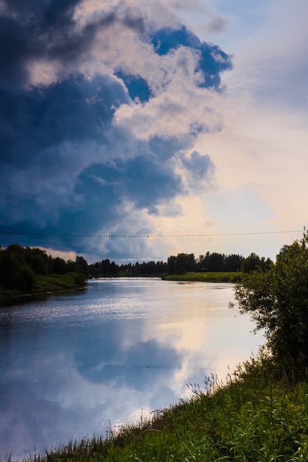 Heavy Clouds On A Summer Night. The night is falling but the clouds predict a rain after the sunset in the rural Finland stock images Heavy Clouds On A Summer Night. The night is falling but the clouds predict a rain after the sunset in the rural Finland stock images