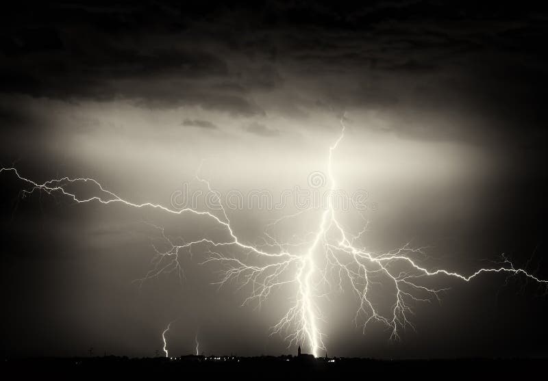 Heavy clouds, thunder, lightnings and rain during storm over city stock images