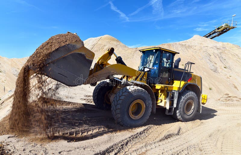 Heavy construction machine in open-cast mining - wheel loader tr royalty free stock photography