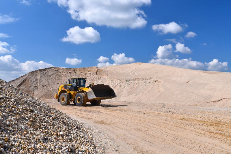 Heavy construction machine in open-cast mining - wheel loader tr royalty free stock image