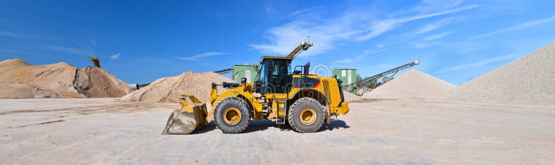 Heavy construction machine in open-cast mining - wheel loader tr stock images