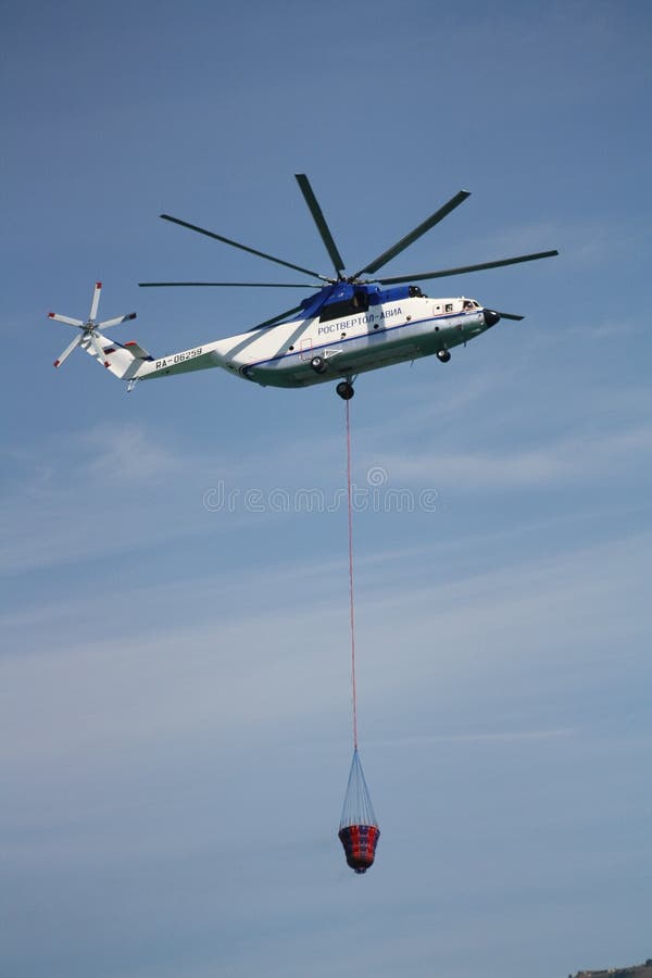 Heavy Helicopter Mi26T with Polyethylene Drum Editorial Photography