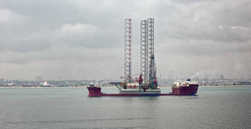 Heavy lift vessel loaded with oil rig platform stock photos Heavy lift vessel loaded with oil rig platform stock photos