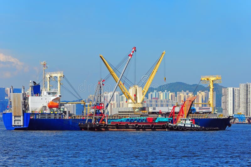 Heavy lift vessel or ship stock photo. Image of buildings 