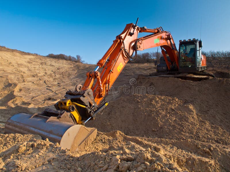 Heavy orange excavator stock photo. Image of engineering 27473666