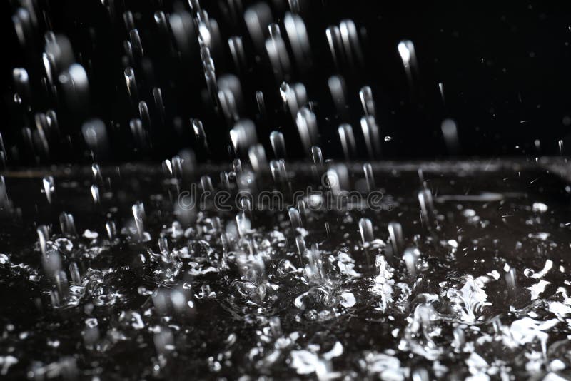 Heavy Rain Falling Down on Ground Against Dark Background Stock Photo -  Image of dark, backdrop: 161910256
