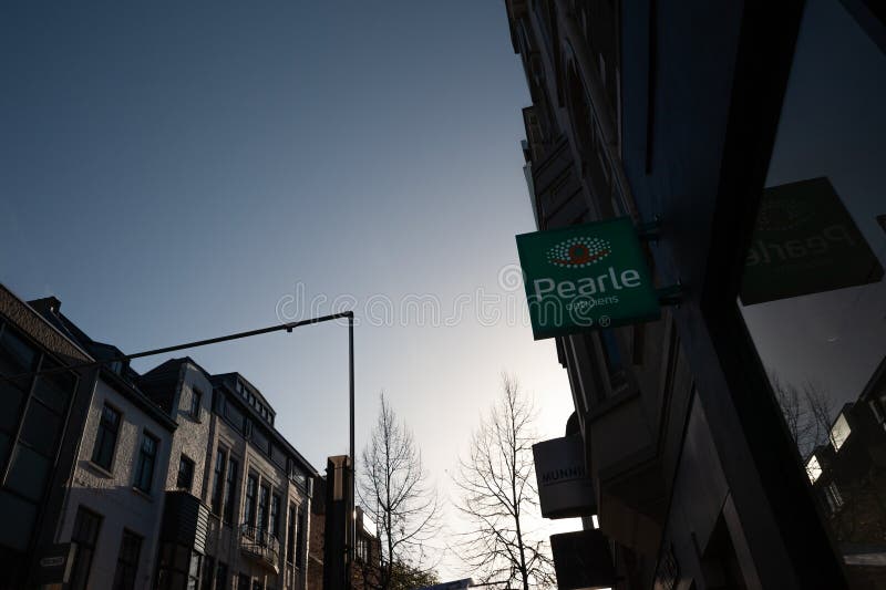 Picture of a sign with the logo of Pearle Opticiens in Heerlen, Netherlands . Pearle Opticiens (formerly Brilmij ) is an international chain of opticians founded in 1959 by Dutchman Alphons Hamer. Worldwide, the chain has about 1,600 branches in fifteen countries. Picture of a sign with the logo of Pearle Opticiens in Heerlen, Netherlands . Pearle Opticiens (formerly Brilmij ) is an international chain of opticians founded in 1959 by Dutchman Alphons Hamer. Worldwide, the chain has about 1,600 branches in fifteen countries