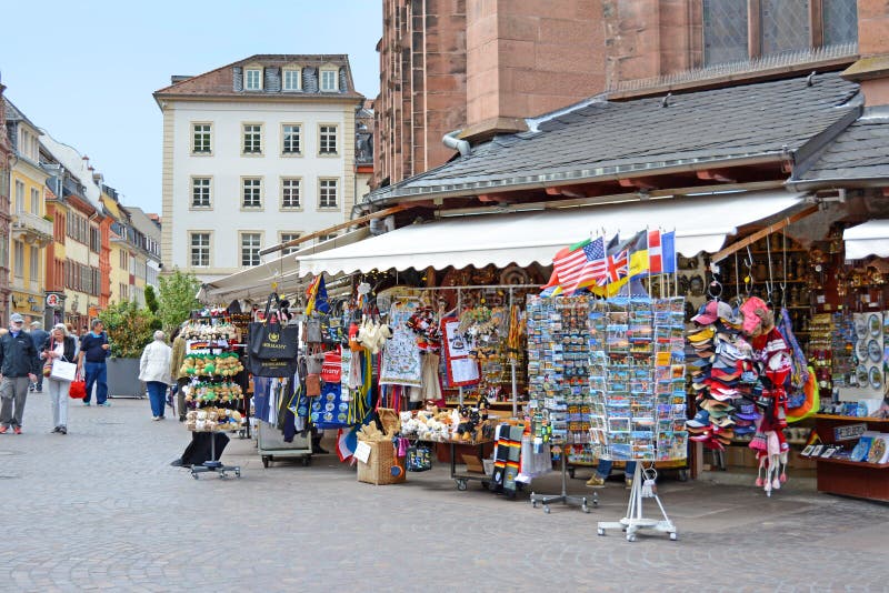 Souvenir shops offering various local trinkets with tourists in front of Church of the Holy Spirit called `Heiliggeistkirche` at m royalty free stock photography Souvenir shops offering various local trinkets with tourists in front of Church of the Holy Spirit called `Heiliggeistkirche` at m royalty free stock photography
