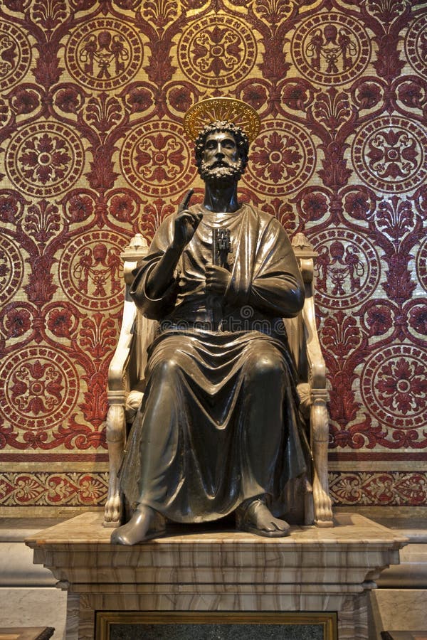 Saint Peter statue in the Basilica of Vatican in Rome, Italy. On this ancient bronze statue, St. Peter has his right toes worn down by centuries of pilgrims who traditionally touch the foot. Saint Peter statue in the Basilica of Vatican in Rome, Italy. On this ancient bronze statue, St. Peter has his right toes worn down by centuries of pilgrims who traditionally touch the foot.