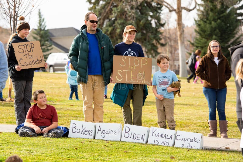 Helena, Montana / Nov 7, 2020: Protesters at `Stop the Steal` rally, children holding signs president elect Joe Biden and Kamala Harris, election was stolen from Donald Trump due to election fraud