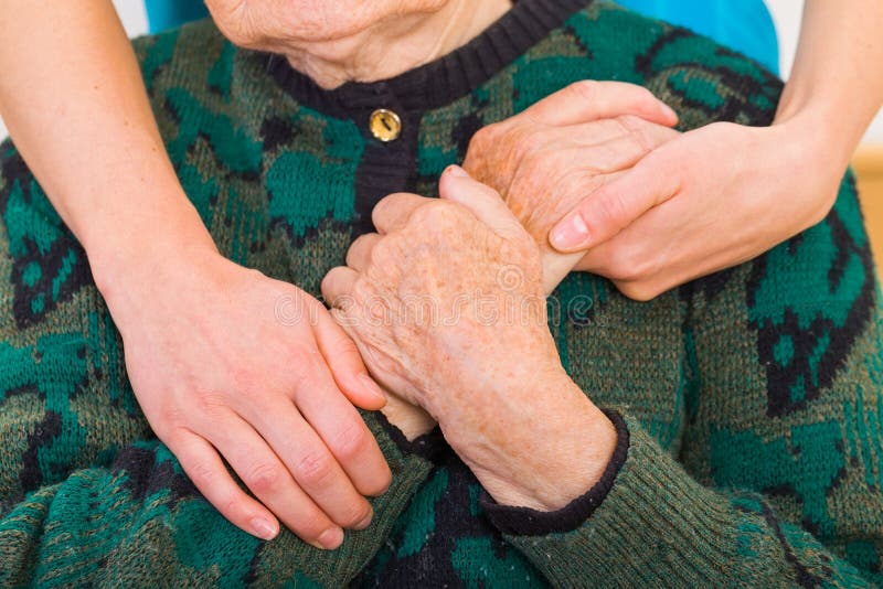 Young doctor giving helping hands for elderly woman. Young doctor giving helping hands for elderly woman