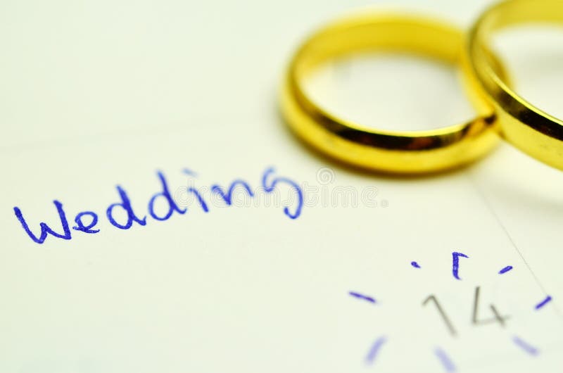 Couple of Wedding Rings on Calender symbolizing wedding date or anniversary. Couple of Wedding Rings on Calender symbolizing wedding date or anniversary