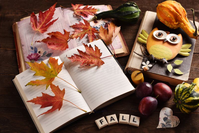Hello Fall background with a diary notebooks and colorful leaves stock image