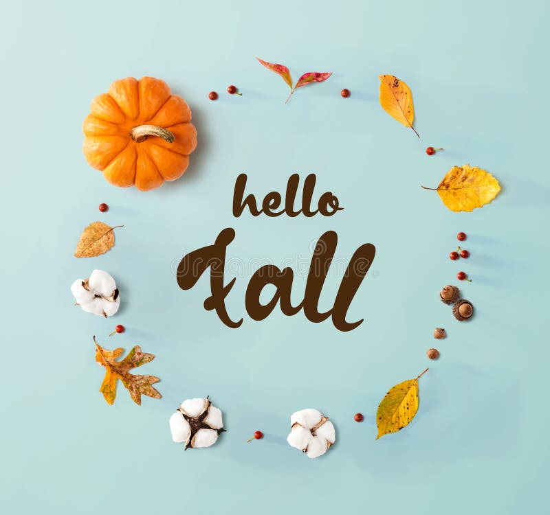 Hello fall message with autumn leaves and orange pumpkin stock photos