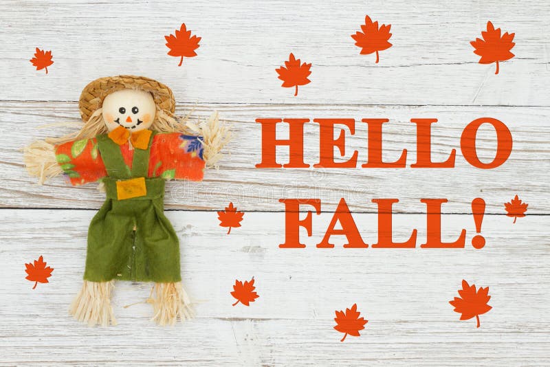 Hello Fall message with a fall scarecrow royalty free stock photography