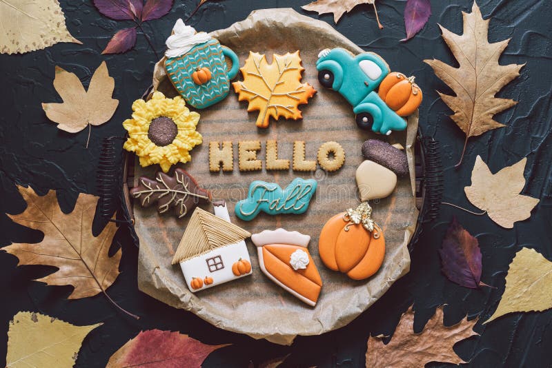 Hello Fall. Multicolored autumn cookies on a black background. royalty free stock photography