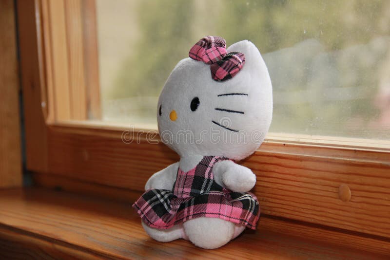 Hello Kitty cute toy on the background of the window