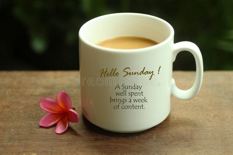 Hello Sunday greetings and quote on white mug of coffee - A Sunday well spent brings a week of content. Morning coffee. Sunday white coffee concept with text notes, self reminder on a mug and beautiful pink bali frangipangi flower arrangement